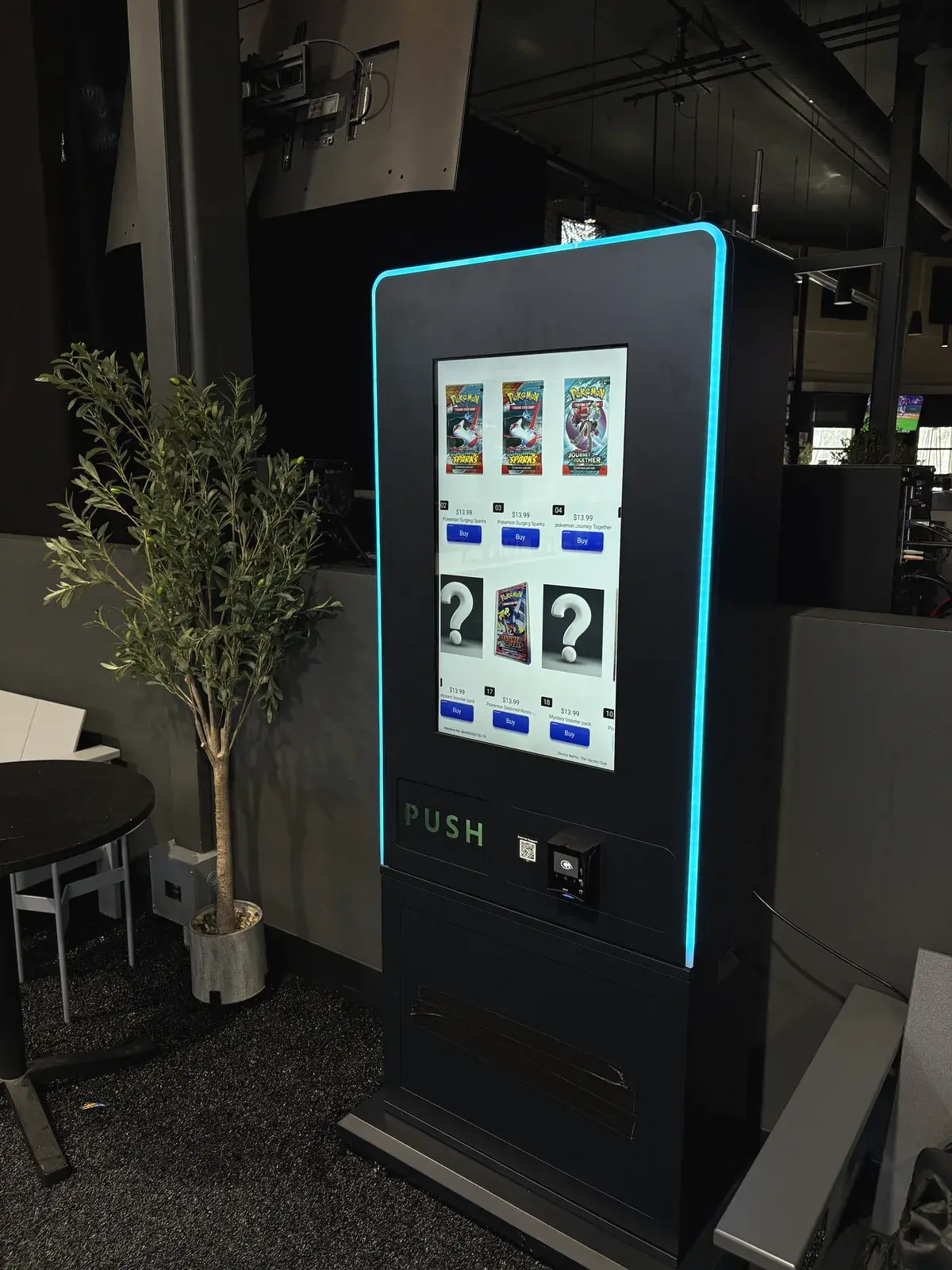 The freestanding tower, a touchscreen Pokémon card vending machine